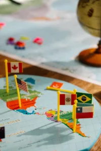 Various international flags placed on a map of the Americas to indicate multilingual SEO and internationalism